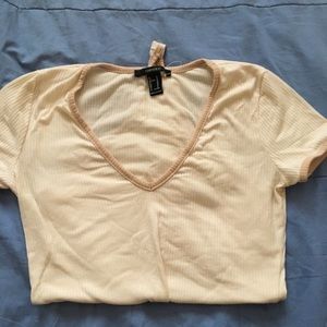 I’m selling this cream bodysuit from forever 21